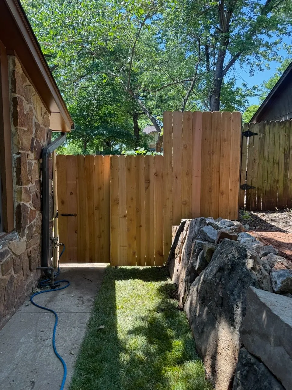 wood privacy fence installed by top rail fence