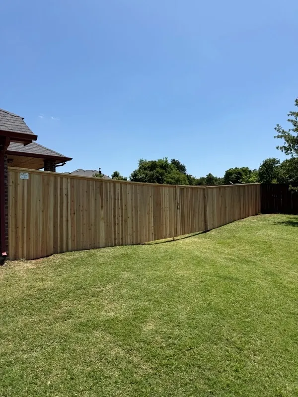 wood privacy fence installed by top rail fence
