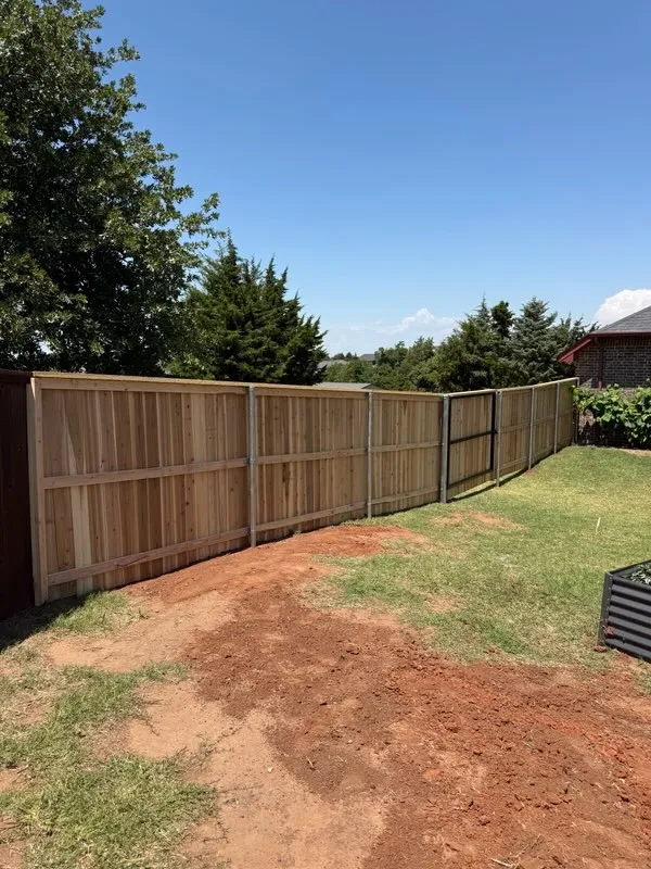 wood privacy fence installed by top rail fence
