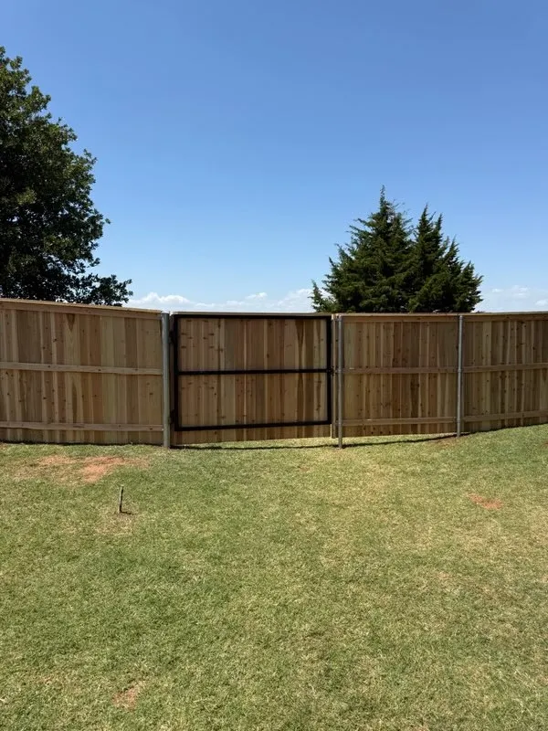 wood privacy fence installed by top rail fence