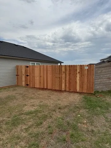 wood privacy fence installed by top rail fence
