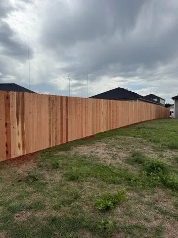 wood privacy fence installed by top rail fence