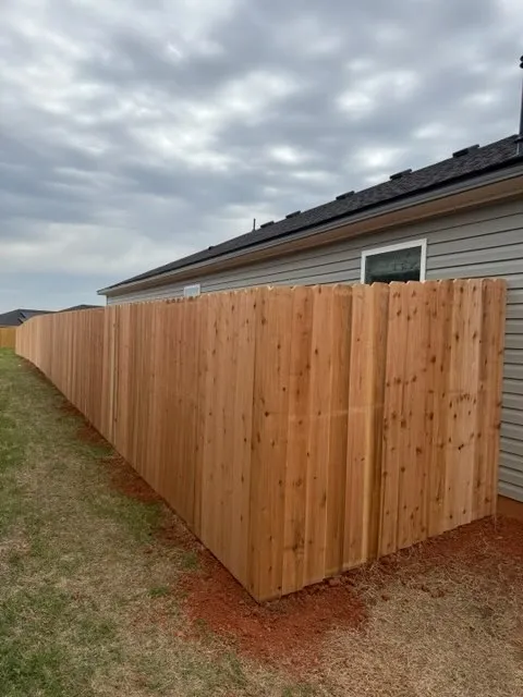 wood privacy fence installed by top rail fence