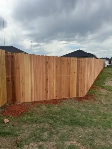 wood privacy fence installed by top rail fence