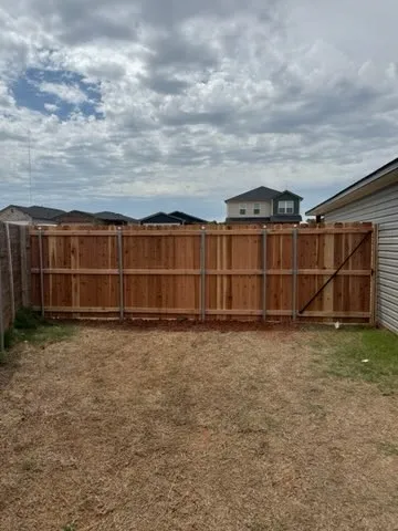 wood privacy fence installed by top rail fence