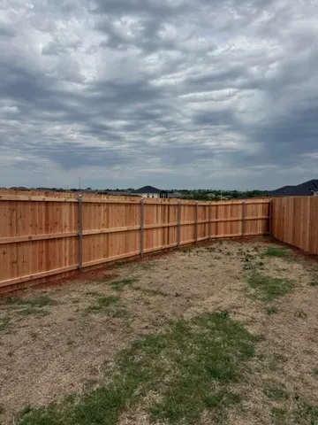wood privacy fence installed by top rail fence