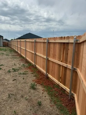 wood privacy fence installed by top rail fence