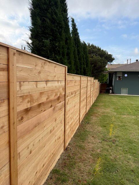 wood horizontal fence installed by top rail fence