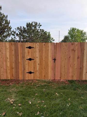 wood stockade fence installed by top rail fence
