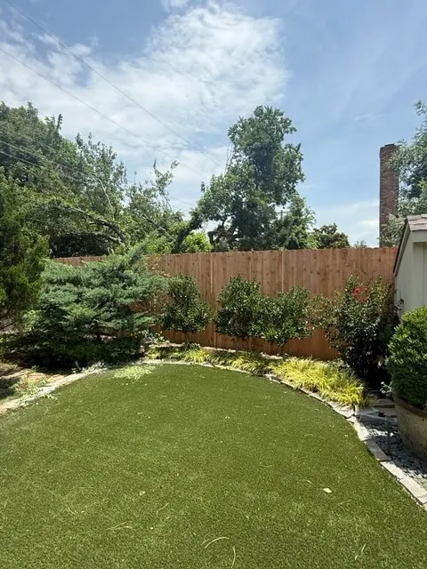 wood stockade fence installed by top rail fence