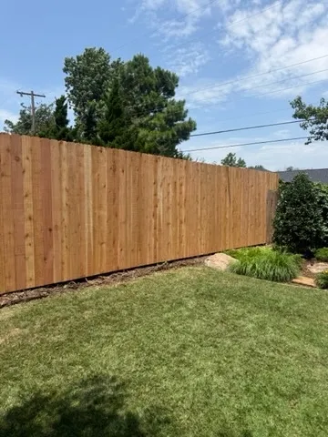 wood stockade fence installed by top rail fence