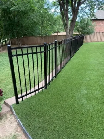 three rail ornamental metal fence installed by top rail fence