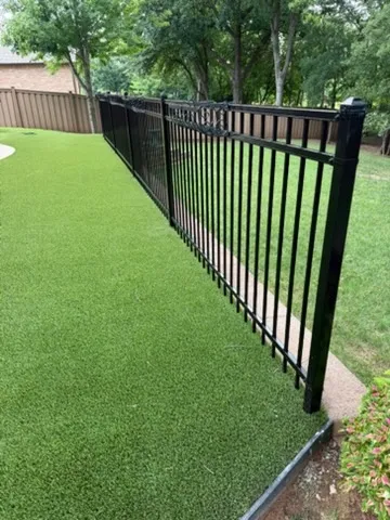 three rail ornamental metal fence installed by top rail fence