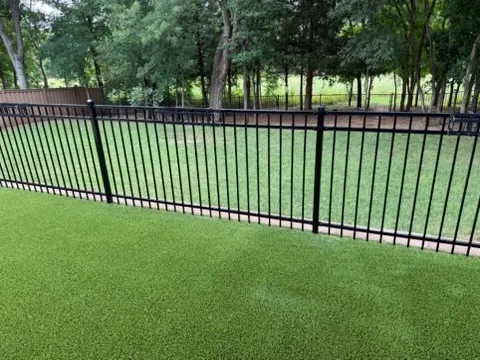 three rail ornamental metal fence installed by top rail fence