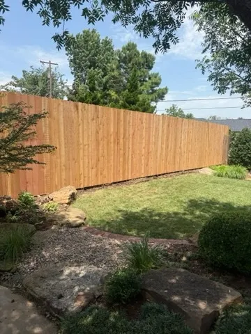 wood stockade fence installed by top rail fence