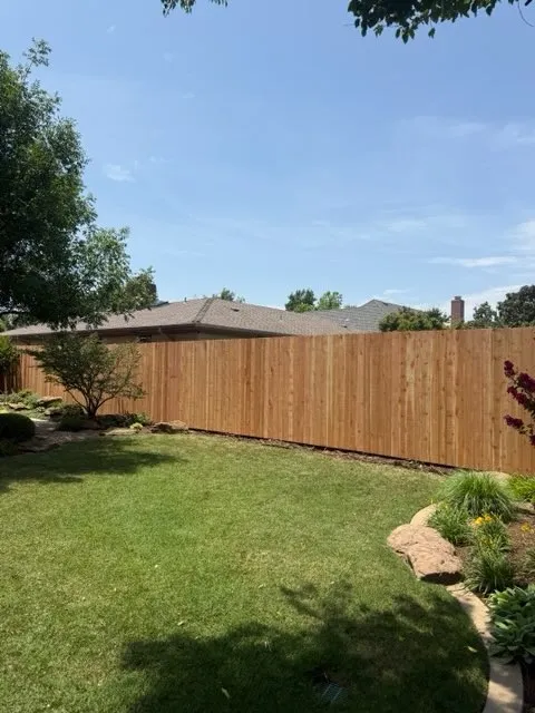wood stockade fence installed by top rail fence