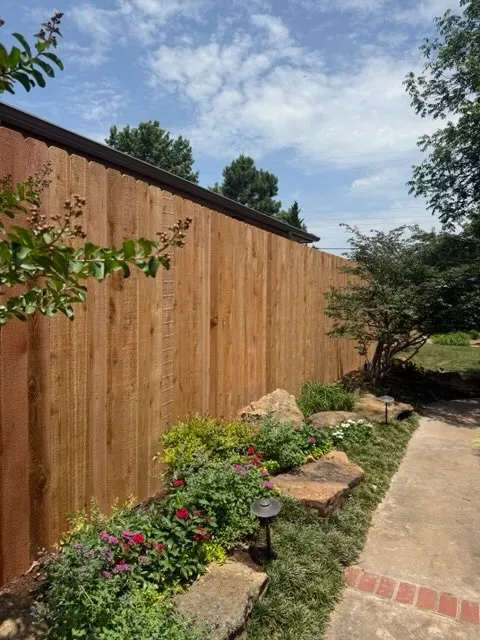 wood stockade fence installed by top rail fence
