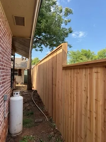 wood stockade fence installed by top rail fence