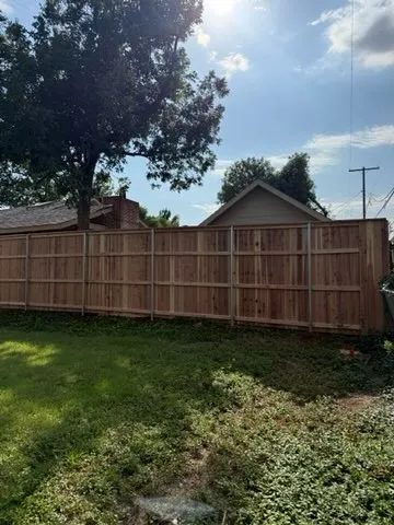 wood stockade fence installed by top rail fence