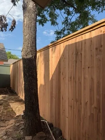 wood stockade fence installed by top rail fence