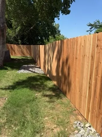 wood privacy fence installed by top rail fence