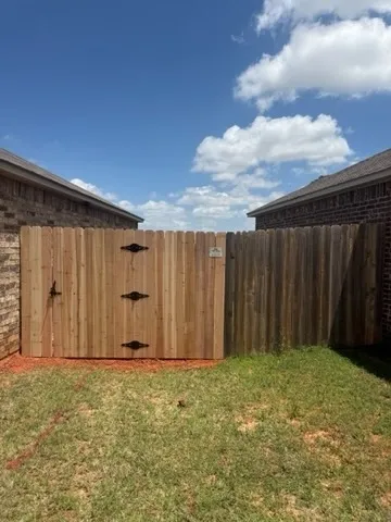 wood privacy fence installed by top rail fence