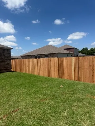 wood privacy fence installed by top rail fence