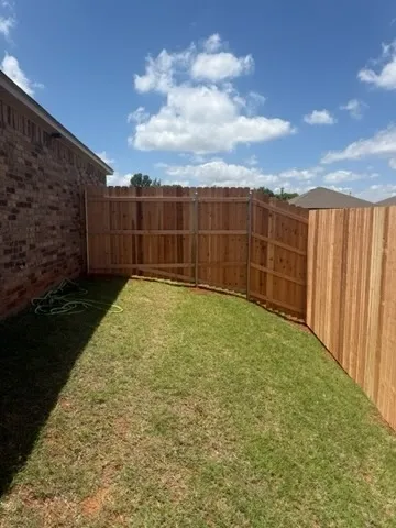 wood privacy fence installed by top rail fence