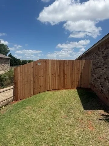 wood privacy fence installed by top rail fence