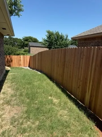 wood privacy fence installed by top rail fence