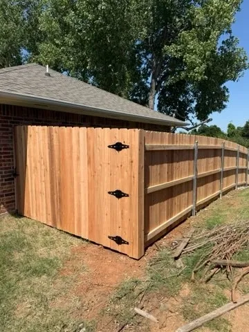 wood privacy fence installed by top rail fence