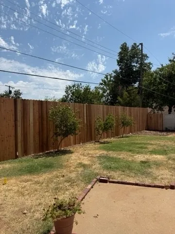 wood stockade fence installed by top rail fence