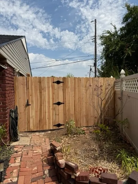 wood stockade fence installed by top rail fence