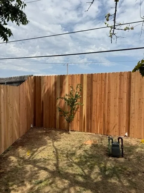 wood stockade fence installed by top rail fence