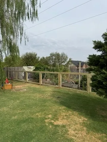 wood ranch rail fence installed by top rail fence