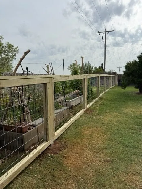 wood ranch rail fence installed by top rail fence