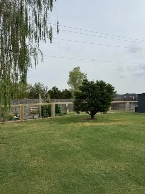 wood ranch rail fence installed by top rail fence