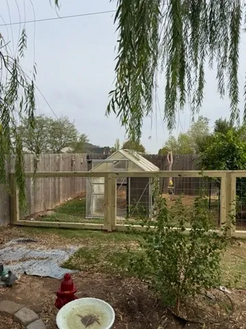 wood ranch rail fence installed by top rail fence