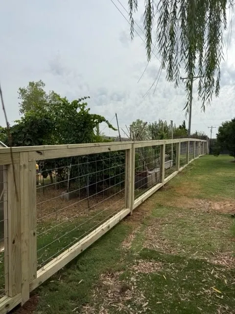 wood ranch rail fence installed by top rail fence