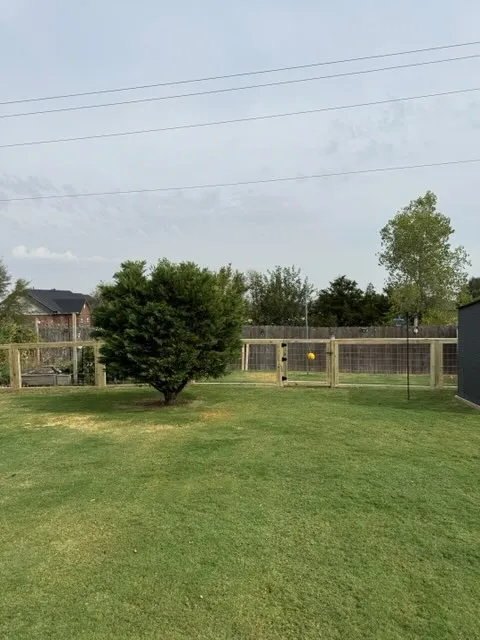 wood ranch rail fence installed by top rail fence