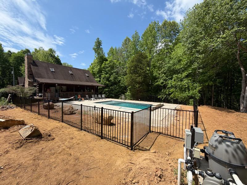 two rail ornamental metal fence installed by top rail fence