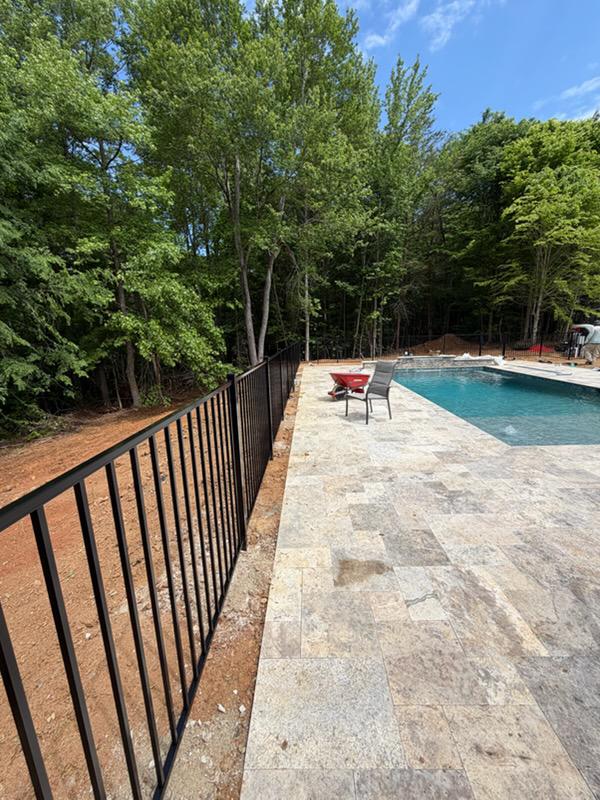 two rail ornamental metal fence installed by top rail fence