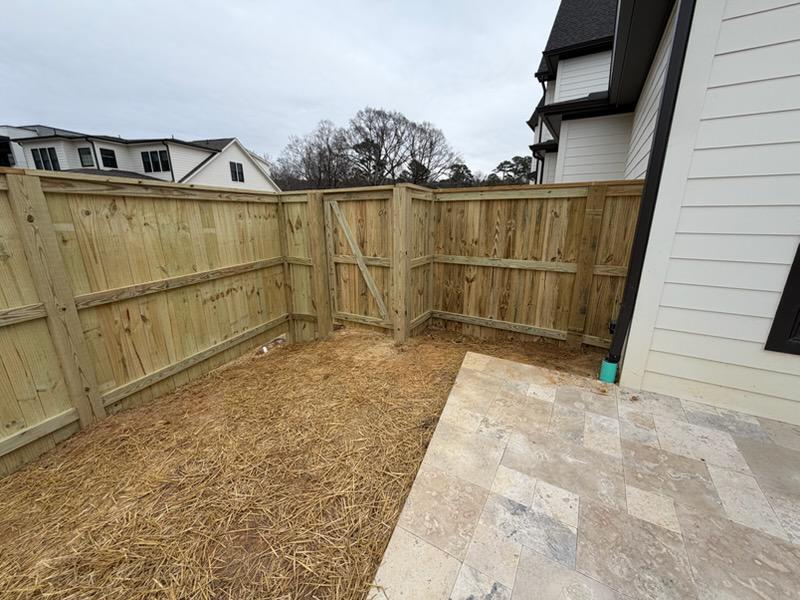 wood cap and trim fence installed by top rail fence