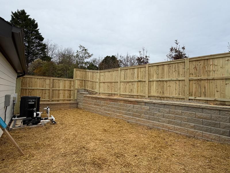 wood cap and trim fence installed by top rail fence
