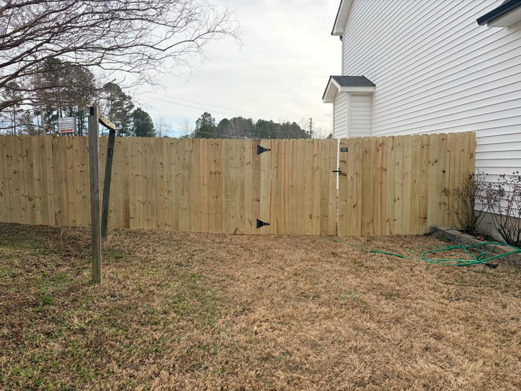  wood stockade fence installed by top rail fence