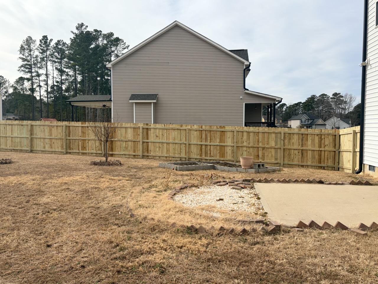  wood stockade fence installed by top rail fence