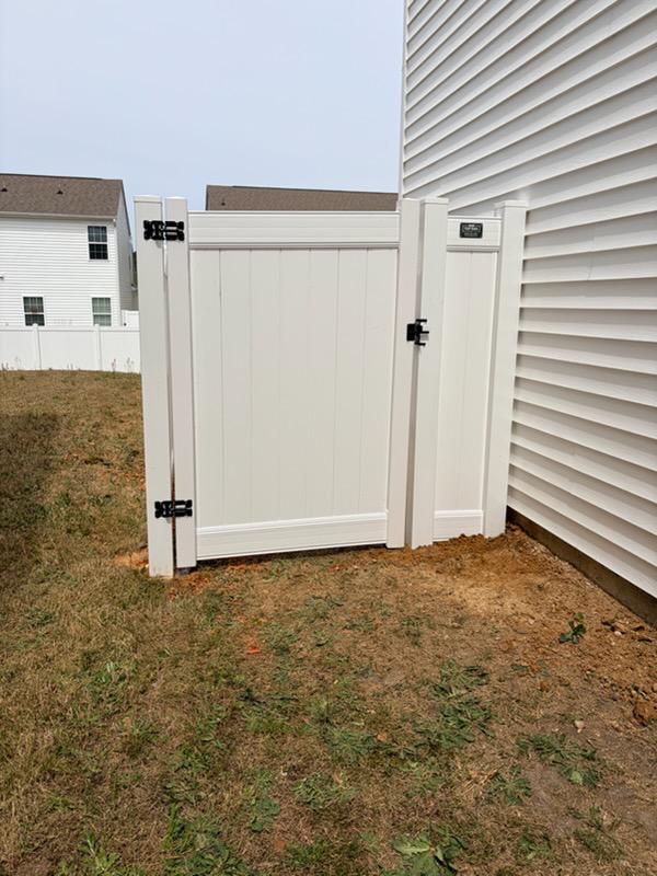 vinyl privacy fence installed by top rail fence