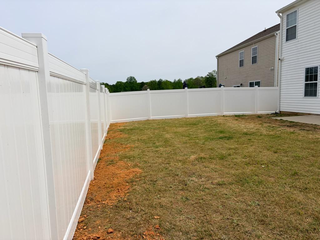 vinyl privacy fence installed by top rail fence