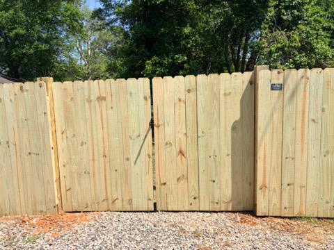  wood stockade fence installed by top rail fence