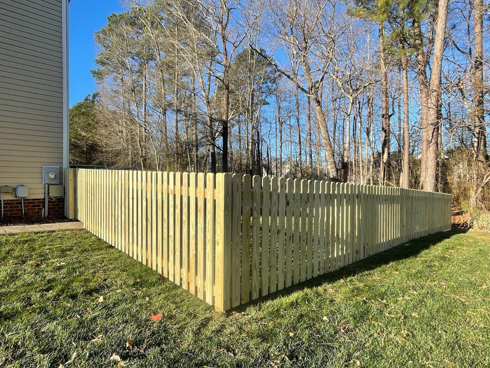 wood picket fence installed by top rail fence